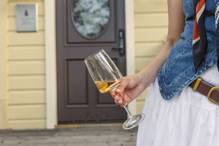 a person holding a glass of wine