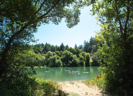 image of serene spot along the russian river with people kayaking