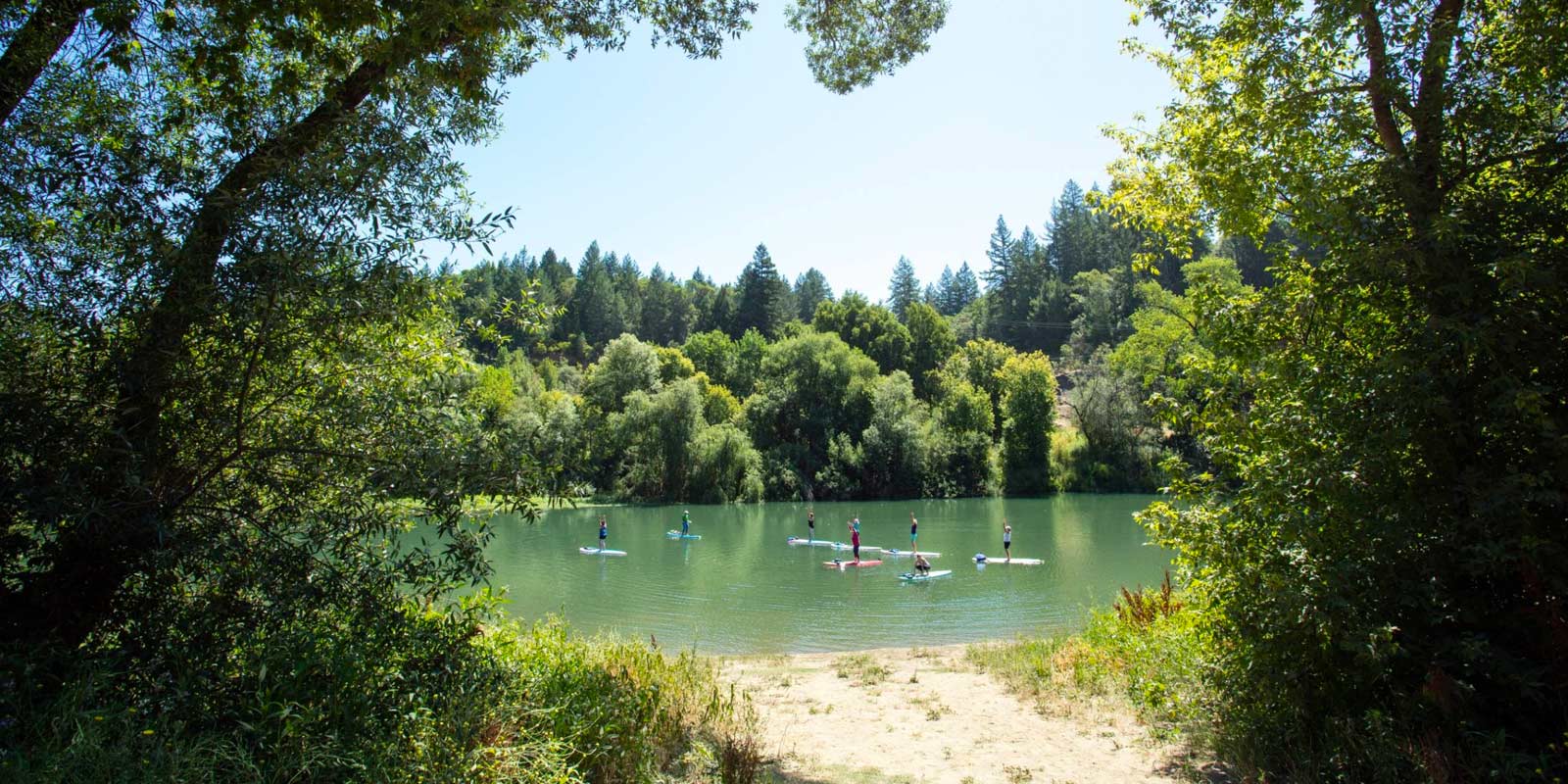 image of serene spot along the russian river with people kayaking