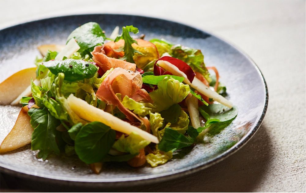 mixed green salad with fruits and meats