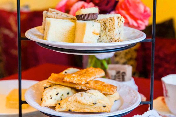 three teared serving dish with pastries