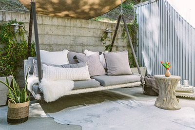 Outdoor Farmhouse Spa swinging couch.