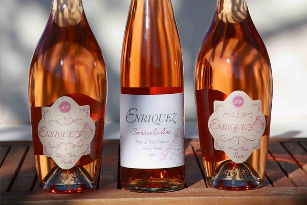 3 bottles of enriquez rose wine bottles