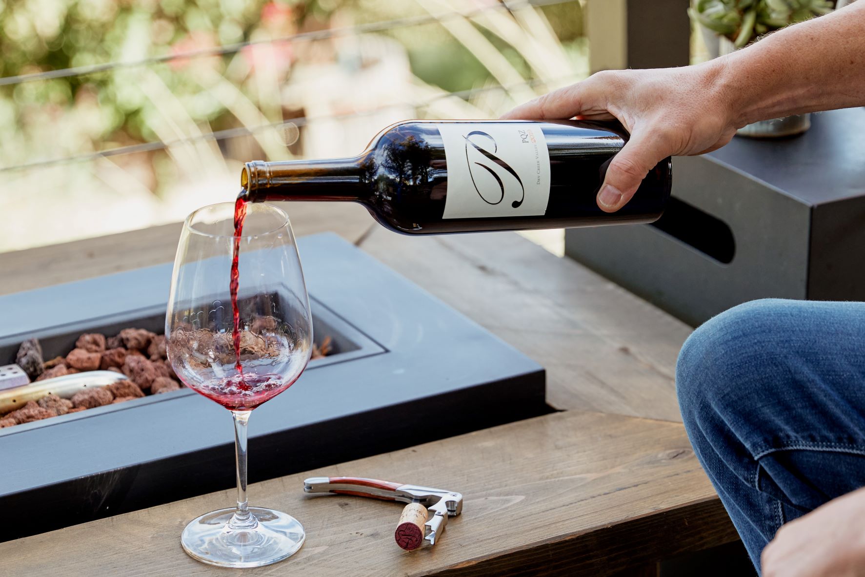 Passalacqua pouring red wine at tasting